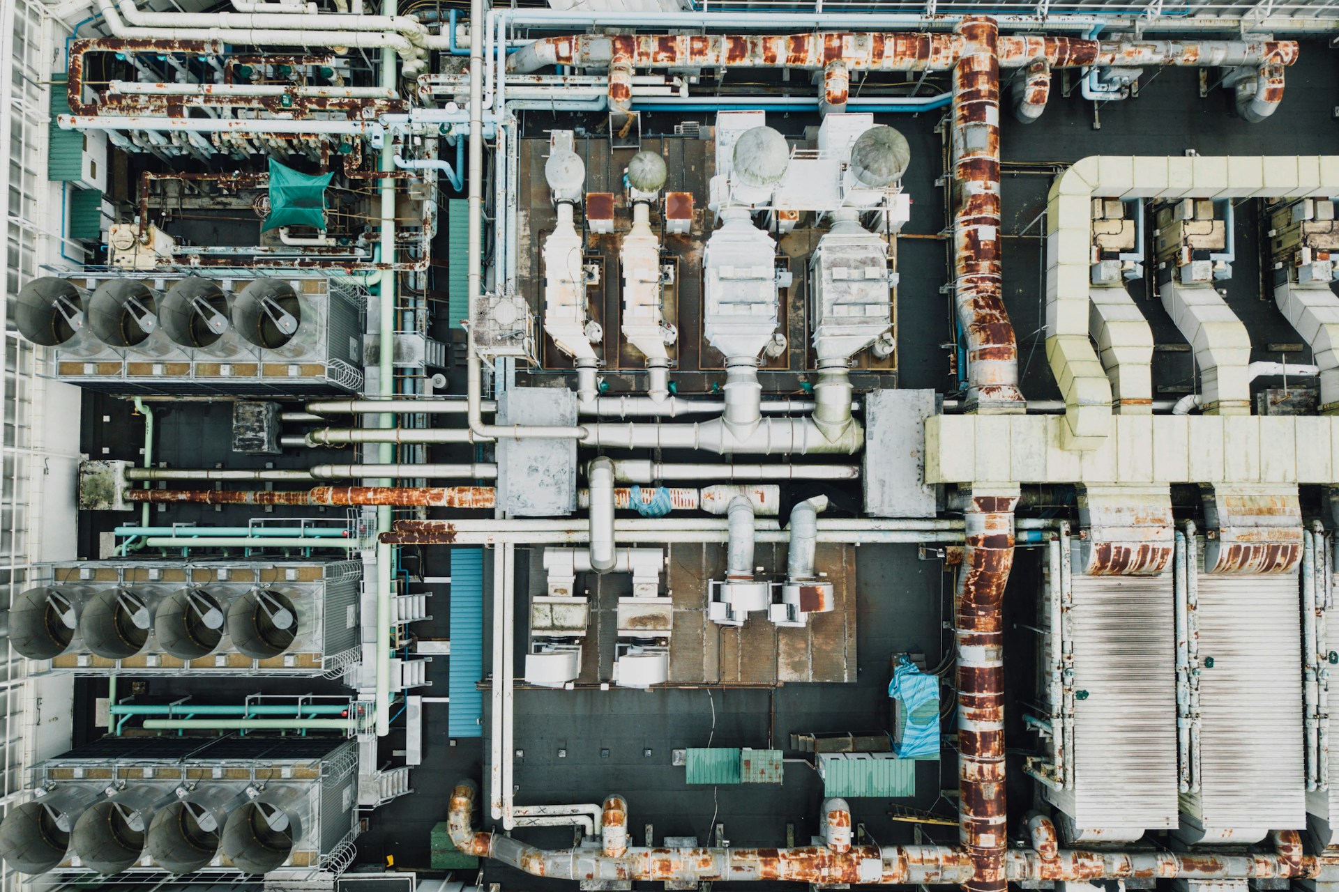 Industrial HVAC technician inspecting specialized equipment