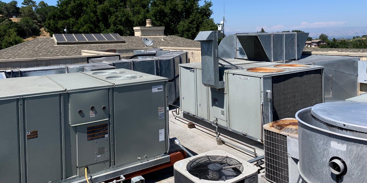 Technician performing preventative maintenance on HVAC system